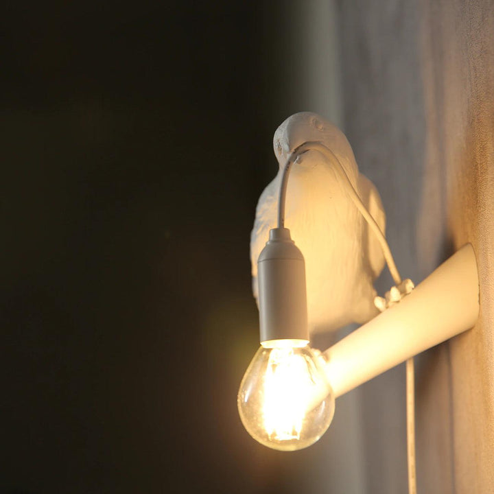 Lampa ścienna ptak