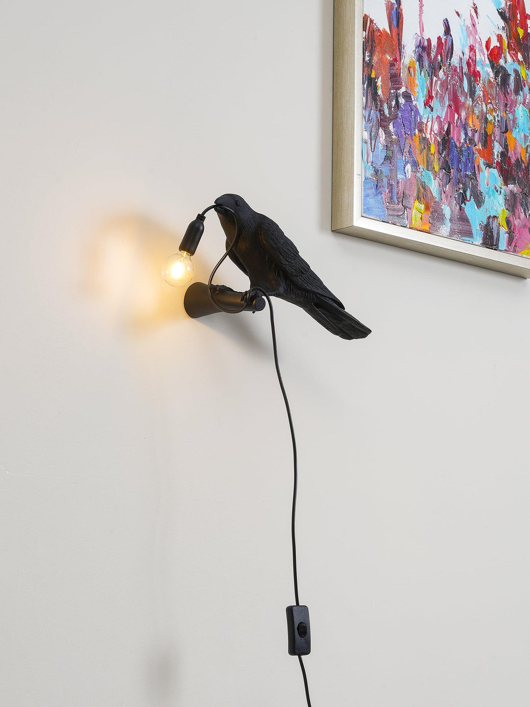 Lampa ścienna ptak