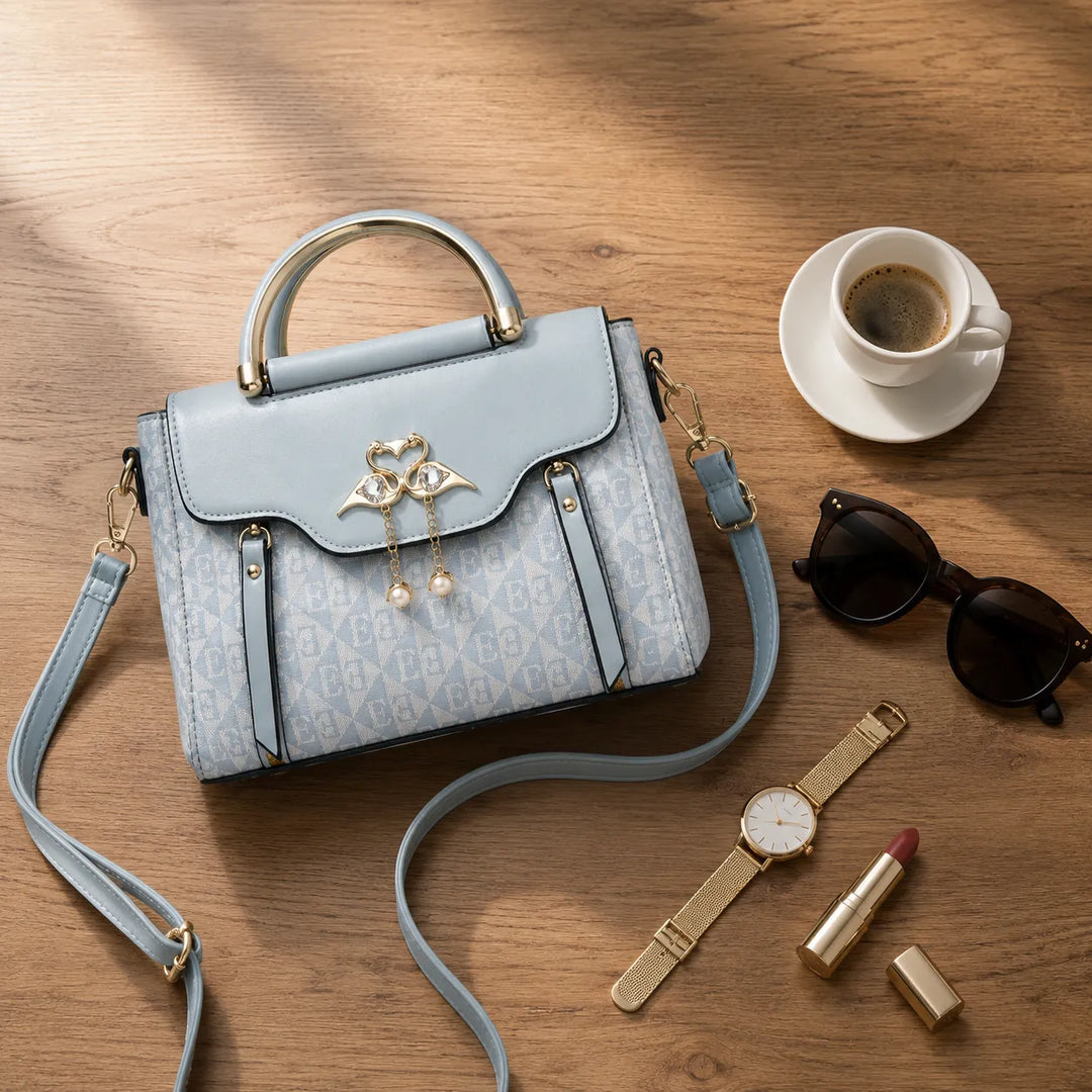 Velora – Torebka crossbody z zapięciem w kształcie łabędzia i złotymi akcentami