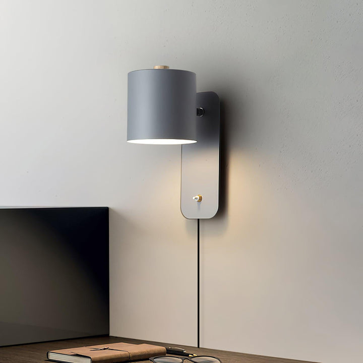 Obrotowa lampa ścienna z cylindrycznym kloszem
