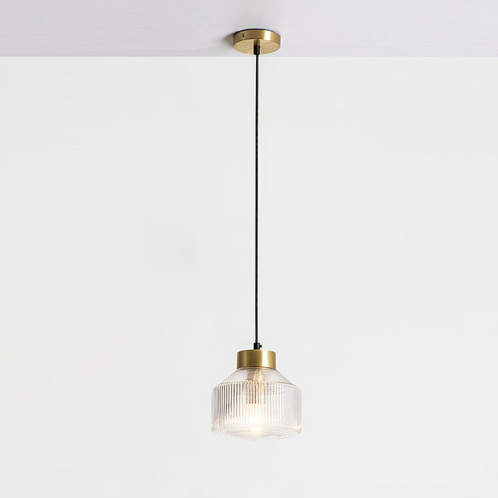 Lampa wisząca w kształcie wirującego bączka w paski