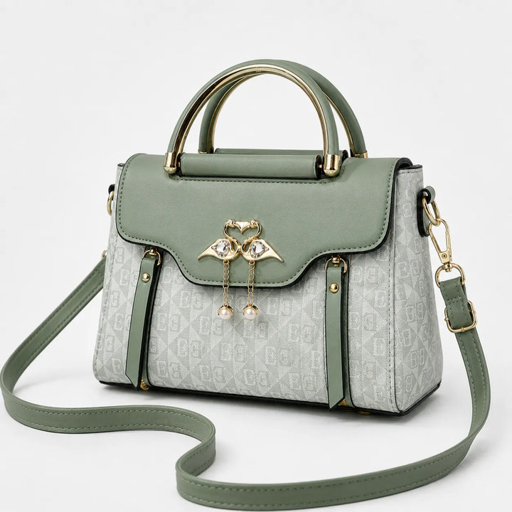Velora – Torebka crossbody z zapięciem w kształcie łabędzia i złotymi akcentami