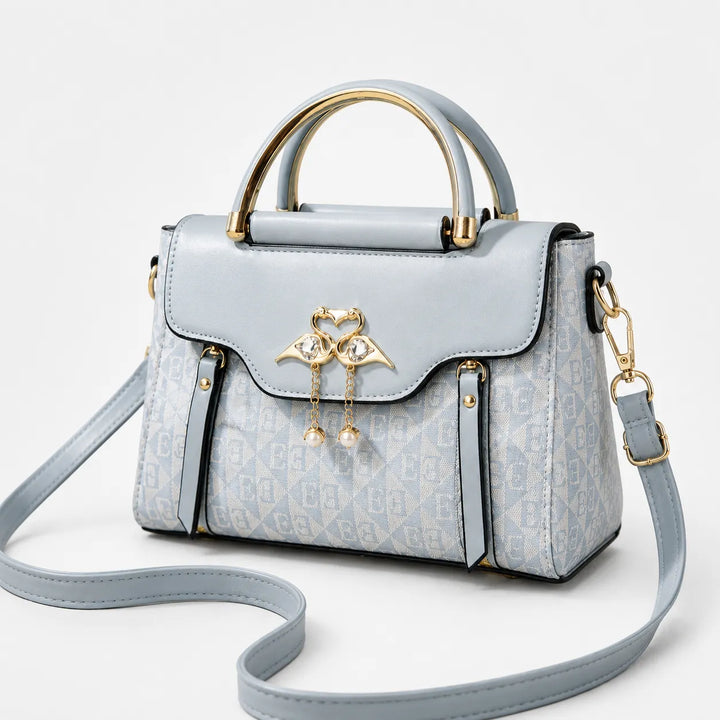 Velora – Torebka crossbody z zapięciem w kształcie łabędzia i złotymi akcentami