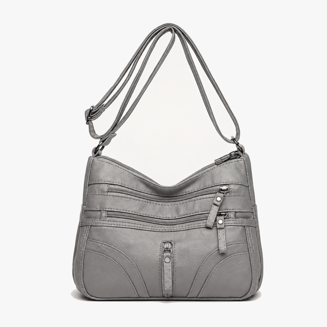 Caressa – Miękka skórzana torebka crossbody z wieloma kieszeniami