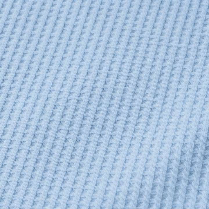 Draperly – Bluzka z asymetrycznym dołem w wyglądzie dzianiny waflowej