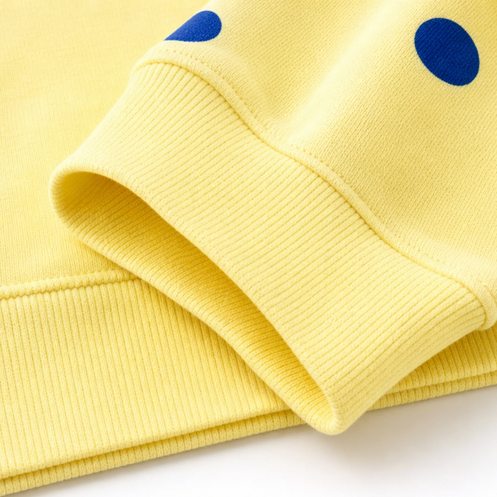 Sunbelle – Sweter z kropkami i wiązaniem na szyi
