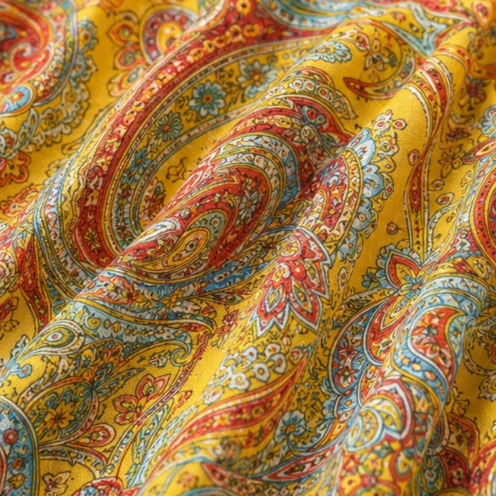 Solivia – Boho sukienka maxi w paisley na szyję z odkrytymi plecami i hemem w kształcie chusty