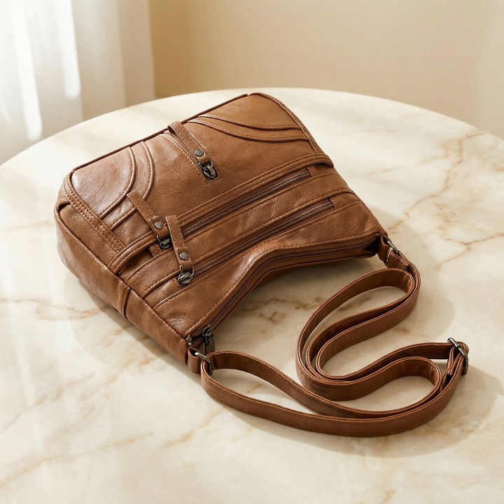 Caressa – Miękka skórzana torebka crossbody z wieloma kieszeniami