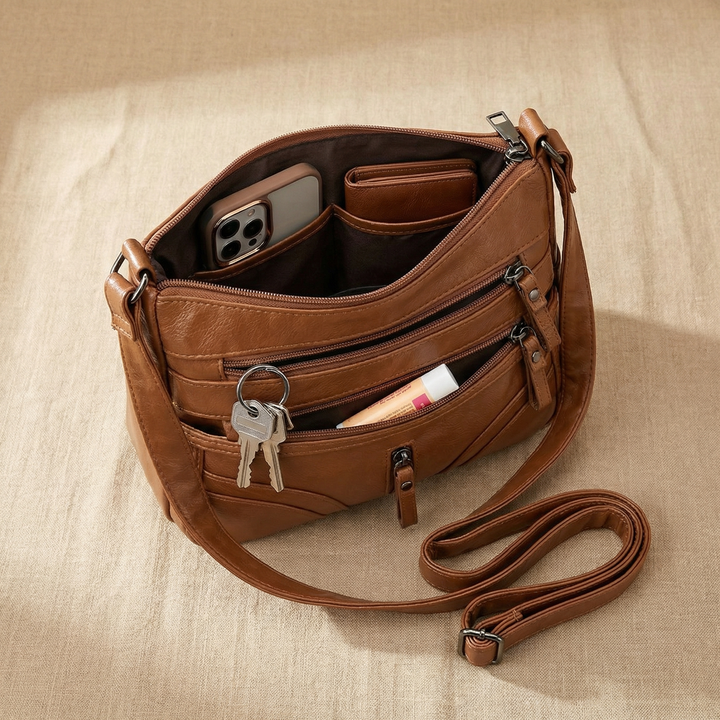Caressa – Miękka skórzana torebka crossbody z wieloma kieszeniami