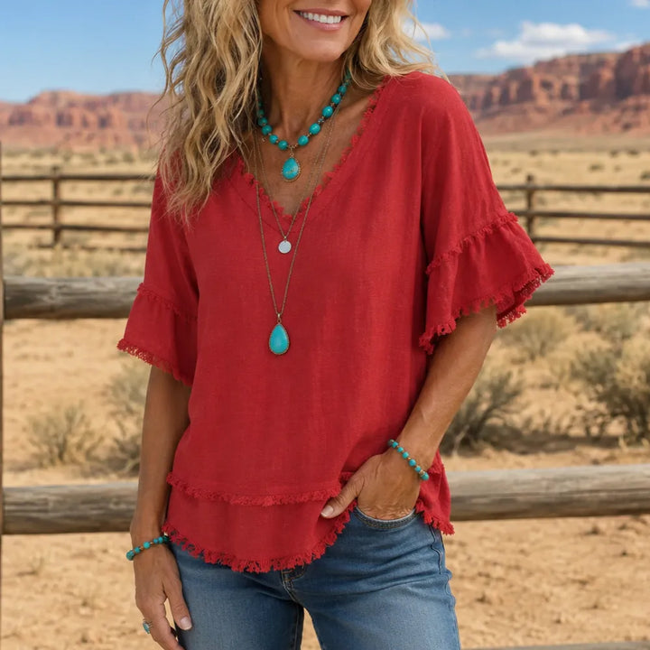 Lorelei – Boho T-shirt z frędzlami w dekolcie V dla kobiet, luźny krój maskujący brzuch